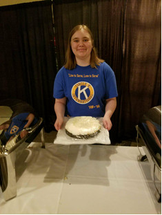 Hannah Workman can be seen showing off one of the delicious cakes to be sold at the live dessert auction!