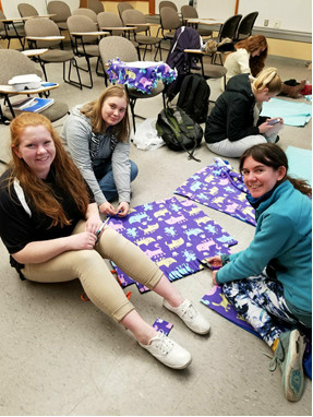 Project organizer Jenni Hickey (on the right), President Diana Bergstrom (on the left), and Hannah Workman (middle)