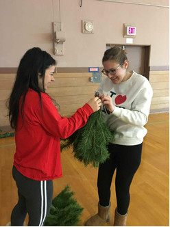 Lilly Miller and Karoline Tyne working with pieces of the big tree!