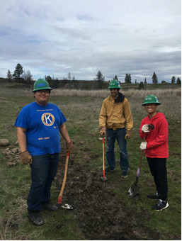 Justin Lee, Zein Charania, and Adriel Supnet working on trail